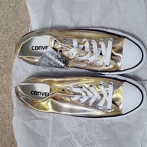 Of Converse women's size 7.5 silver ,gold and white metallic